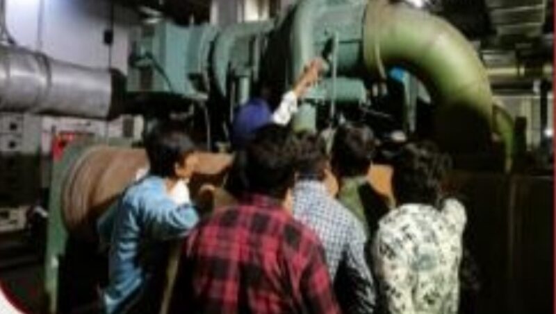 Students learning plant room machinery and compressors